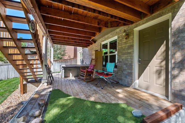 deck with a hot tub