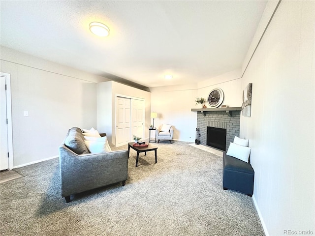 living room with carpet flooring and a brick fireplace