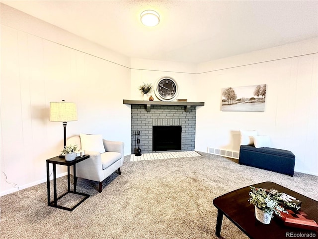 living room with carpet flooring and a fireplace