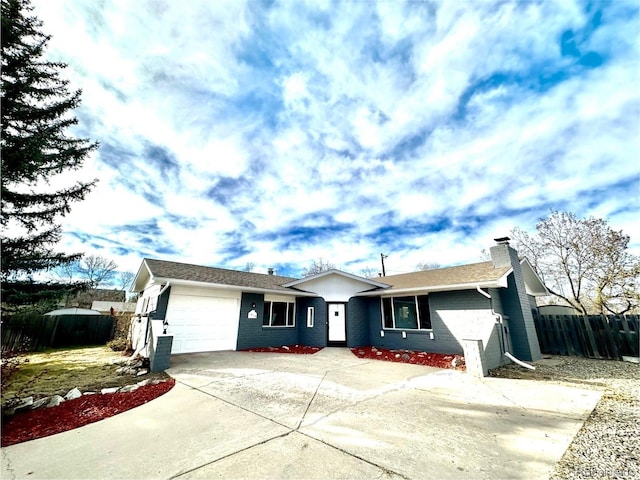 ranch-style house featuring a garage