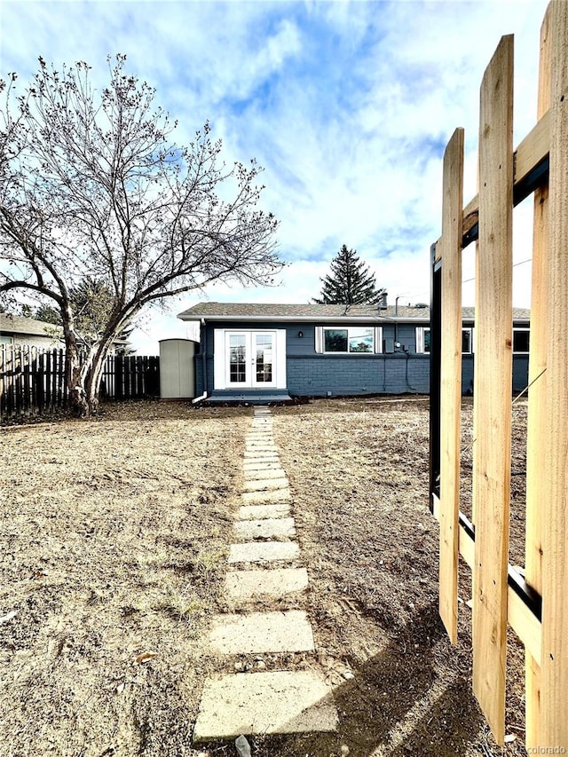 view of yard featuring french doors