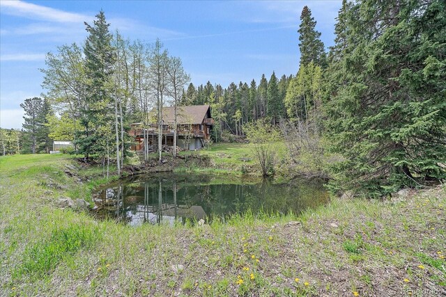 80 Castlewood Ct, Evergreen, CO 80439 - rear view of property featuring a forest view