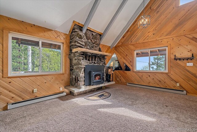 80 Castlewood Ct, Evergreen, CO 80439 - unfurnished living room featuring a baseboard heating unit, wood walls, carpet flooring, a wood stove, and beamed ceiling