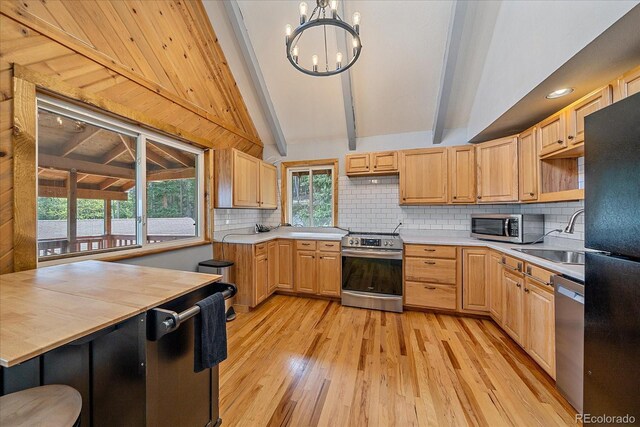 80 Castlewood Ct, Evergreen, CO 80439 - kitchen with appliances with stainless steel finishes, a sink, light wood-style flooring, and plenty of natural light