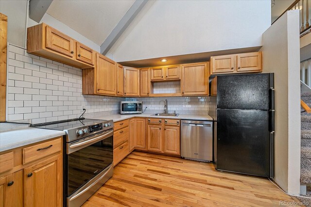 80 Castlewood Ct, Evergreen, CO 80439 - kitchen featuring stainless steel appliances, a sink, light wood-type flooring, and light countertops