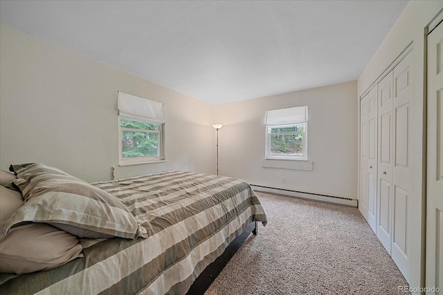 80 Castlewood Ct, Evergreen, CO 80439 - bedroom featuring multiple windows, carpet flooring, a baseboard heating unit, and a closet