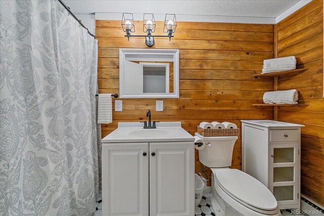 80 Castlewood Ct, Evergreen, CO 80439 - bathroom with toilet, vanity, a shower with shower curtain, baseboard heating, and wooden walls