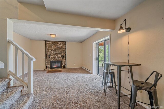 80 Castlewood Ct, Evergreen, CO 80439 - living area featuring stairway, carpet flooring, baseboard heating, a fireplace, and baseboards