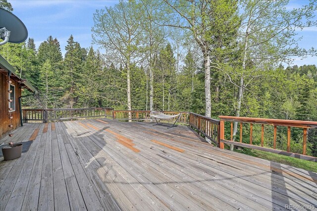 80 Castlewood Ct, Evergreen, CO 80439 - deck featuring a view of trees