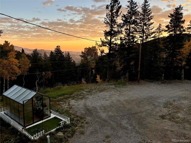 80 Castlewood Ct, Evergreen, CO 80439 - view of yard with an exterior structure and an outdoor structure