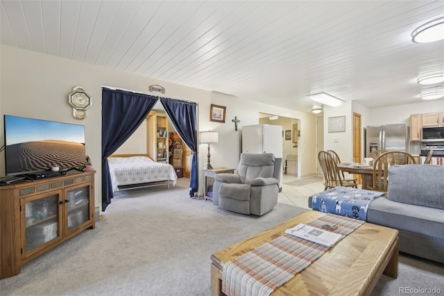 625 S Clinton St Unit 7A, Denver, CO 80247 - living room with light carpet and wood ceiling