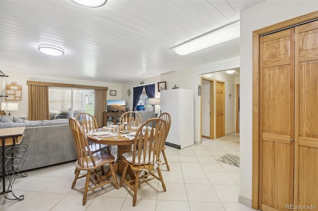 625 S Clinton St Unit 7A, Denver, CO 80247 - dining area featuring light tile patterned flooring