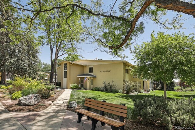 625 S Clinton St Unit 7A, Denver, CO 80247 - view of front of property with a front lawn and stucco siding
