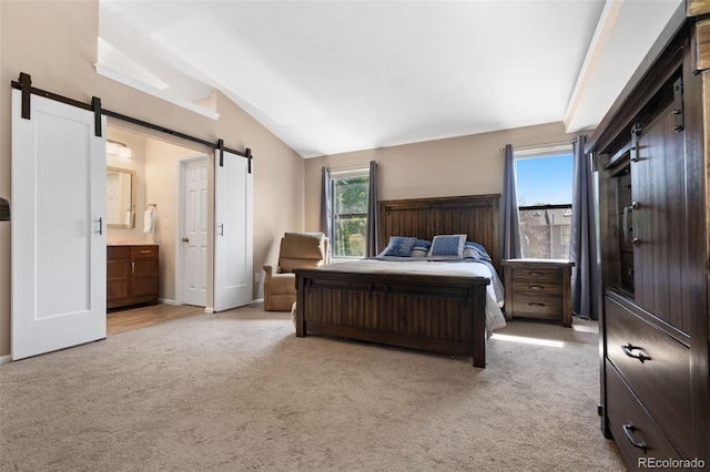 4691 S Fraser Cir Unit A, Aurora, CO 80015 - bedroom with a barn door, light carpet, multiple windows, lofted ceiling, and ensuite bathroom
