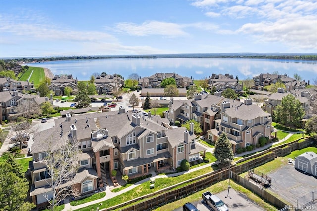 aerial perspective of suburban area with a large body of water
