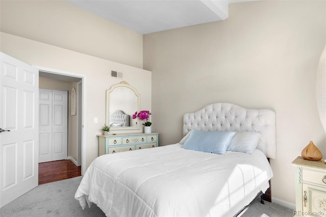 carpeted bedroom featuring baseboards