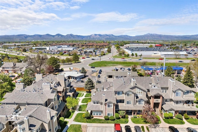 aerial view of residential area featuring a mountainous background