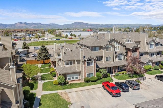 aerial view of residential area with mountains