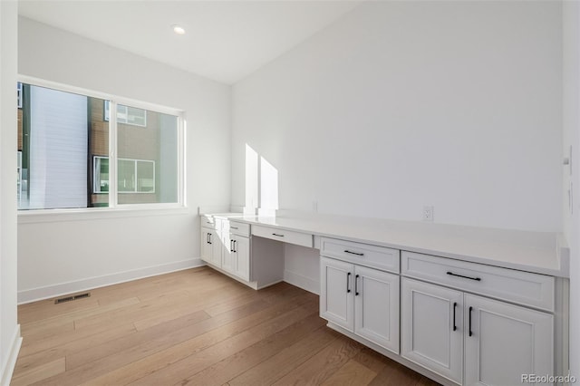 bathroom featuring vanity, baseboards, recessed lighting, visible vents, and wood finished floors