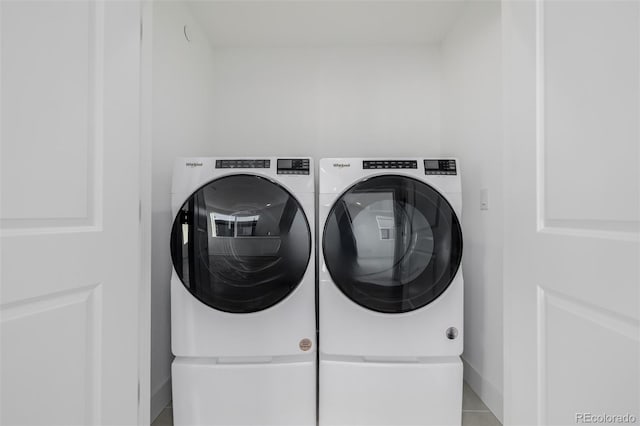laundry area featuring independent washer and dryer and laundry area