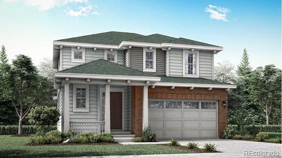 traditional-style house with a garage, driveway, and brick siding