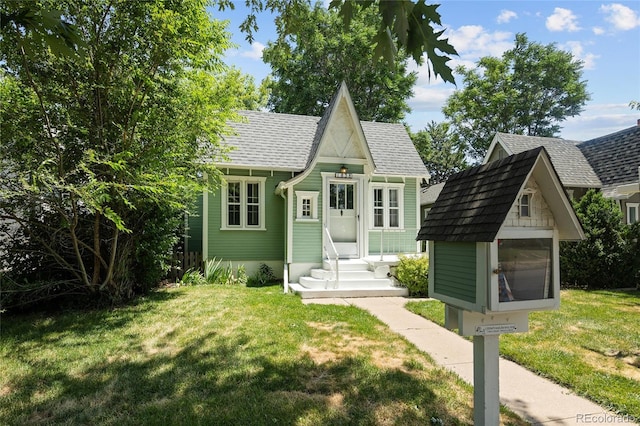1838 S Williams St, Denver, CO 80210 - view of front of home featuring a front lawn, an outbuilding, and entry steps