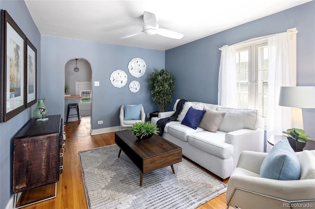 1838 S Williams St, Denver, CO 80210 - living area featuring arched walkways, a ceiling fan, and wood finished floors