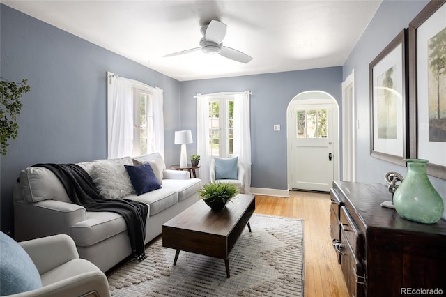 1838 S Williams St, Denver, CO 80210 - living room with ceiling fan, light wood finished floors, and arched walkways