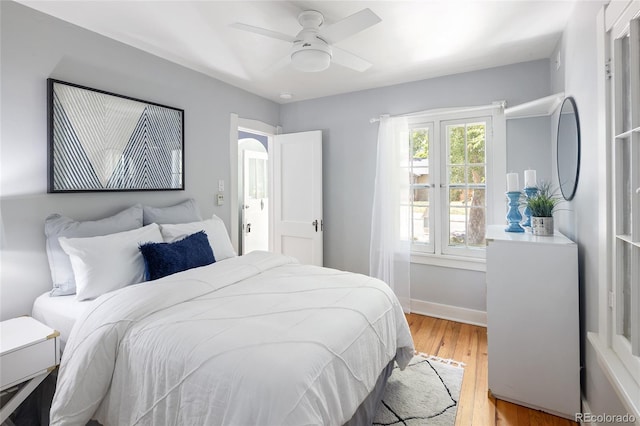 1838 S Williams St, Denver, CO 80210 - bedroom with light wood-style flooring and a ceiling fan
