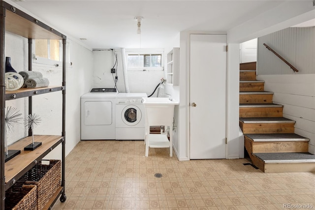1838 S Williams St, Denver, CO 80210 - laundry room with washing machine and dryer and tile patterned floors