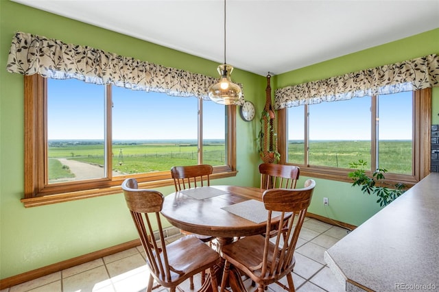 12891 County Road 29, Sterling, CO 80751 - dining space with light tile patterned floors and a view of rural / pastoral area