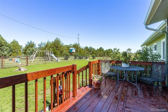 12891 County Road 29, Sterling, CO 80751 - wooden deck featuring a fenced backyard and a playground
