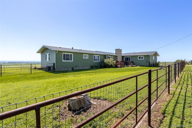 12891 County Road 29, Sterling, CO 80751 - rear view of house with a rural view and a chimney