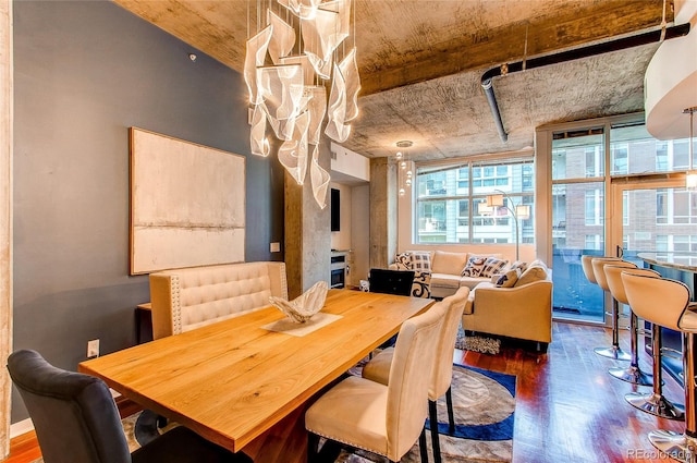 dining area with dark hardwood / wood-style floors