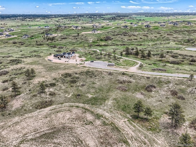 birds eye view of property featuring a rural view