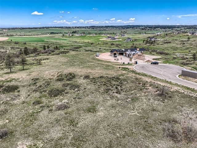 birds eye view of property featuring a rural view