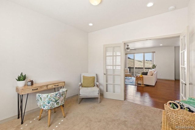 living area featuring baseboards, french doors, and recessed lighting