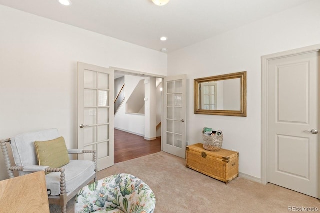 sitting room with carpet floors, recessed lighting, french doors, and baseboards