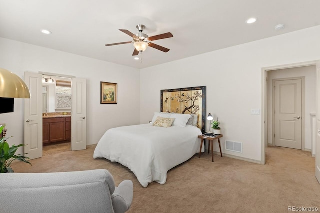 bedroom with recessed lighting, light colored carpet, visible vents, and baseboards