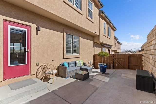 view of patio / terrace with outdoor lounge area and fence