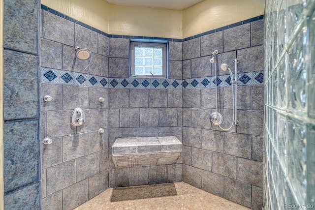 bathroom featuring a tile shower