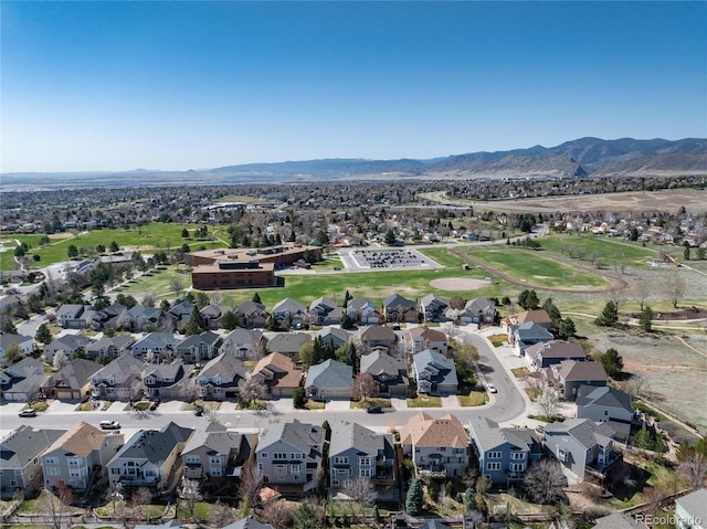 birds eye view of property with a residential view and a mountain view