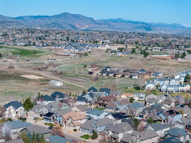 birds eye view of property featuring a mountain view
