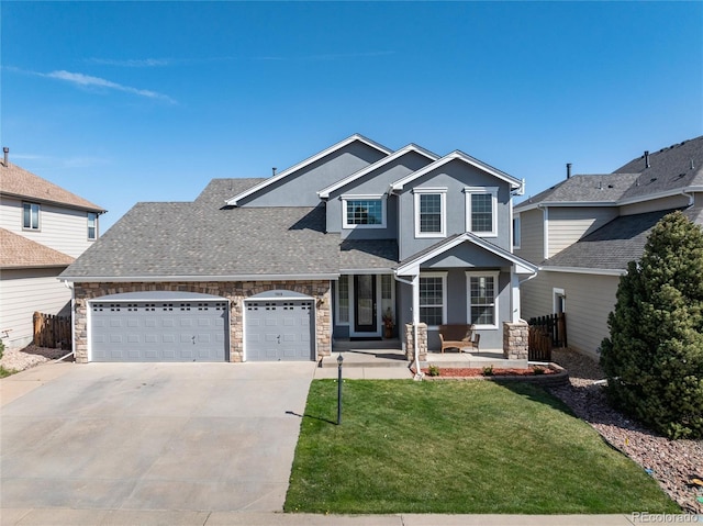 craftsman-style house featuring a front yard, an attached garage, stone siding, covered porch, and driveway