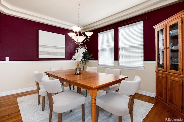 dining area with wood finished floors and baseboards