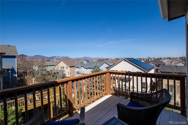 wooden deck with a mountain view and a residential view