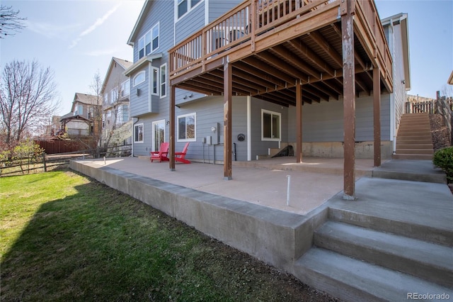 view of patio / terrace with fence and stairway