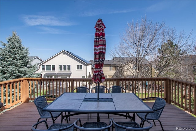 wooden deck featuring outdoor dining space