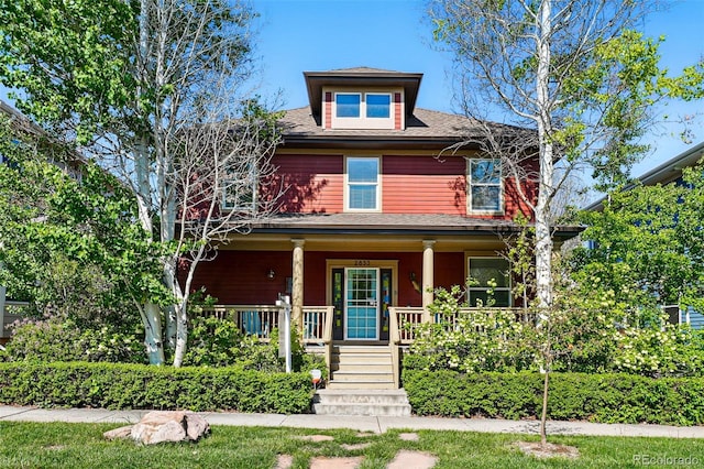 2853 Yosemite St, Denver, CO 80238 - traditional style home with a porch and roof with shingles