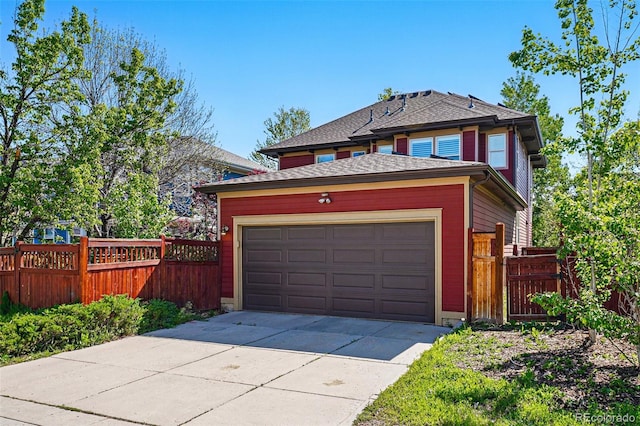 2853 Yosemite St, Denver, CO 80238 - view of front of property with fence, driveway, and an attached garage